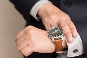 Businessman checking the time on his wrist watch