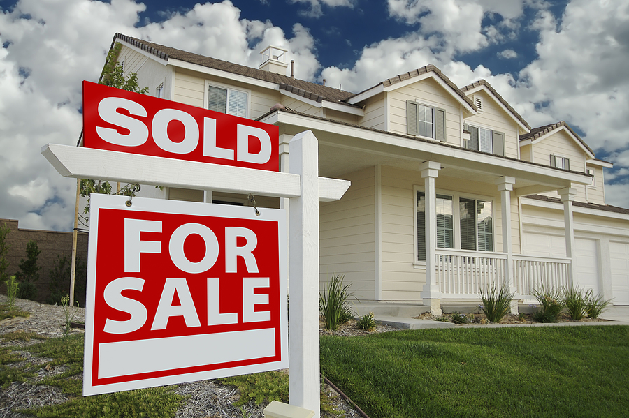 Sold Home For Sale Sign in Front of Beautiful New Home