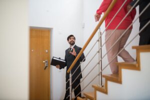 A buyer's agent is walking his clients through a property.